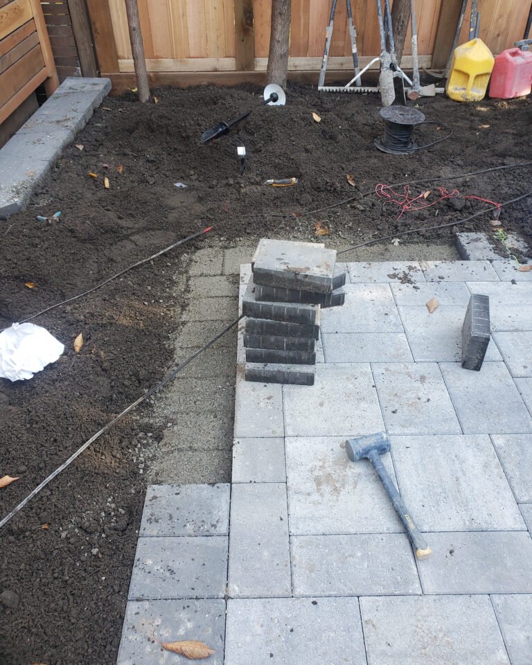 A Backyard Transformed: Synthetic Turf Meets Elegant Pavers