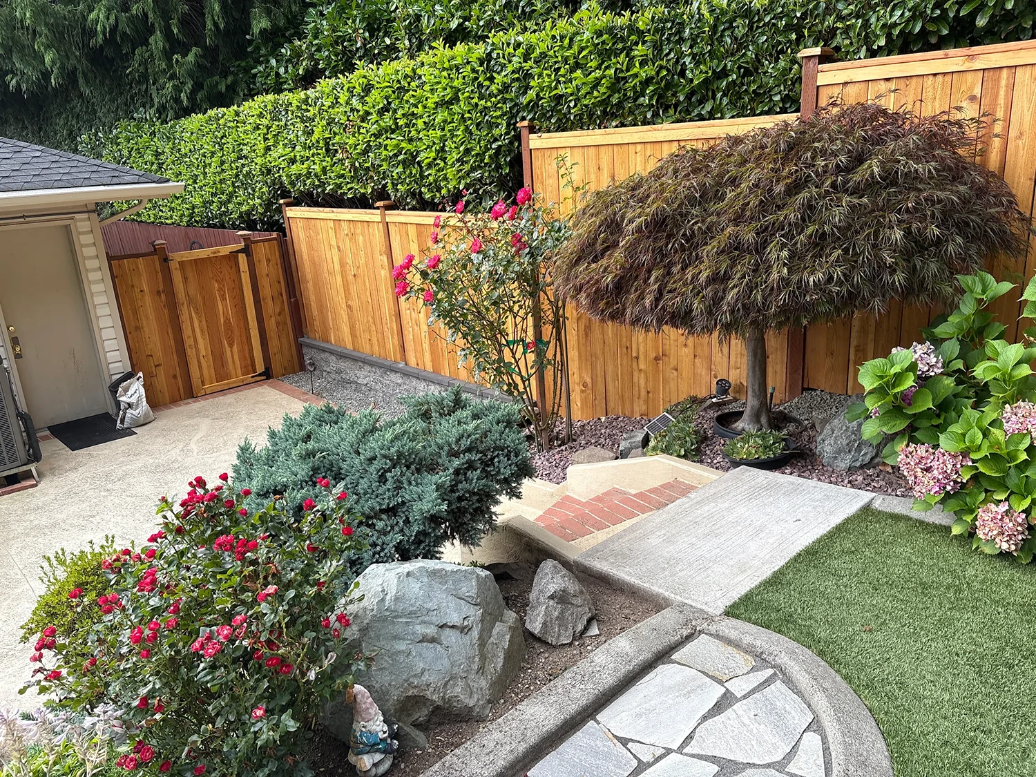 Fence replacement with stone wall and landscape upgrade