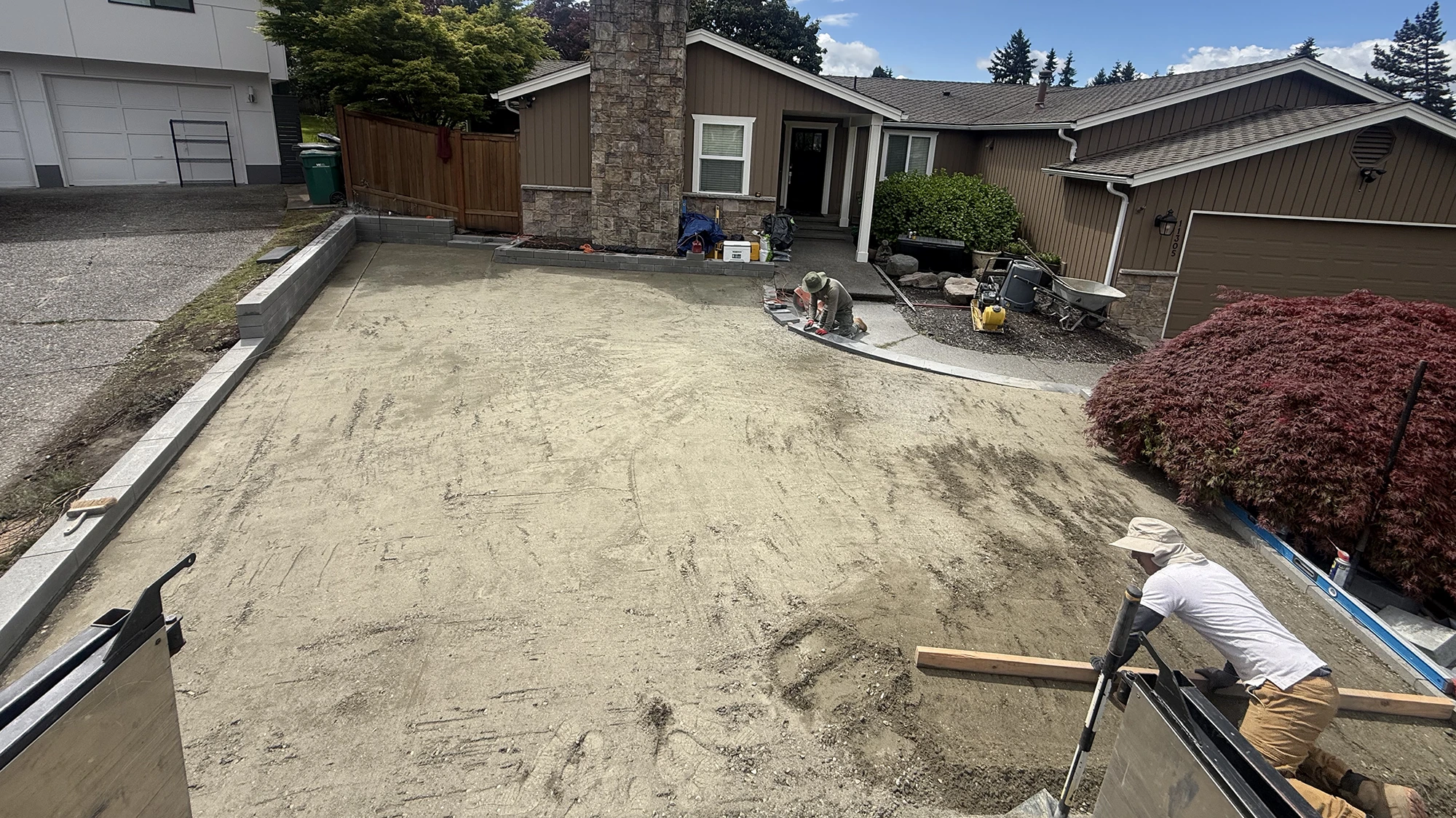 Compacted base and new concrete block borders ready for artificial turf in Kirkland, WA