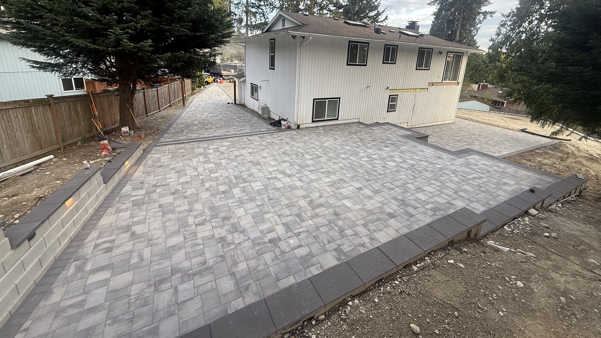 Paver patio wrapping the back of the house in Bothell, WA