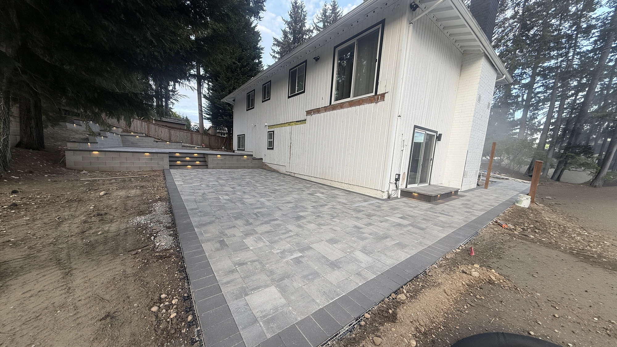 Paver patio with a charcoal soldier border around the home in Bothell, WA