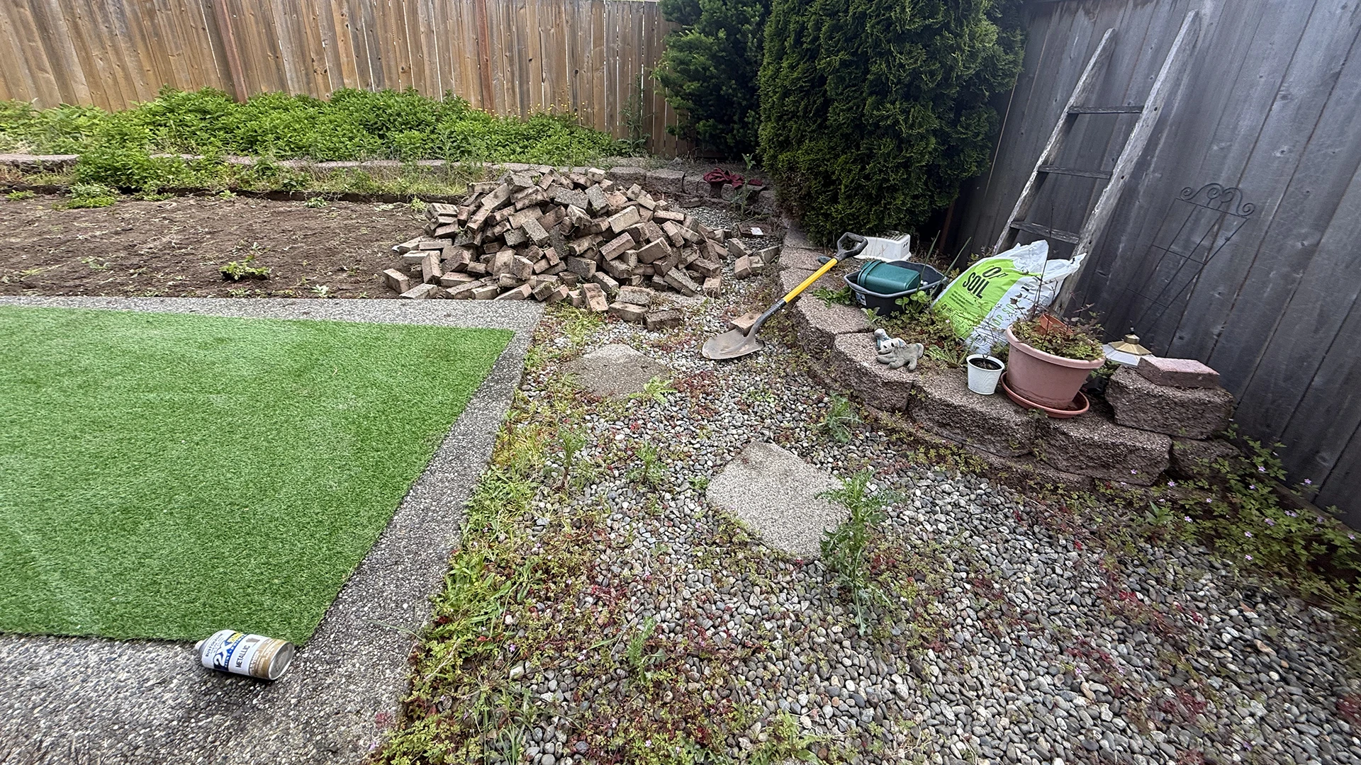 Backyard cleared of the old brick patio and gravel beds in Mill Creek, WA