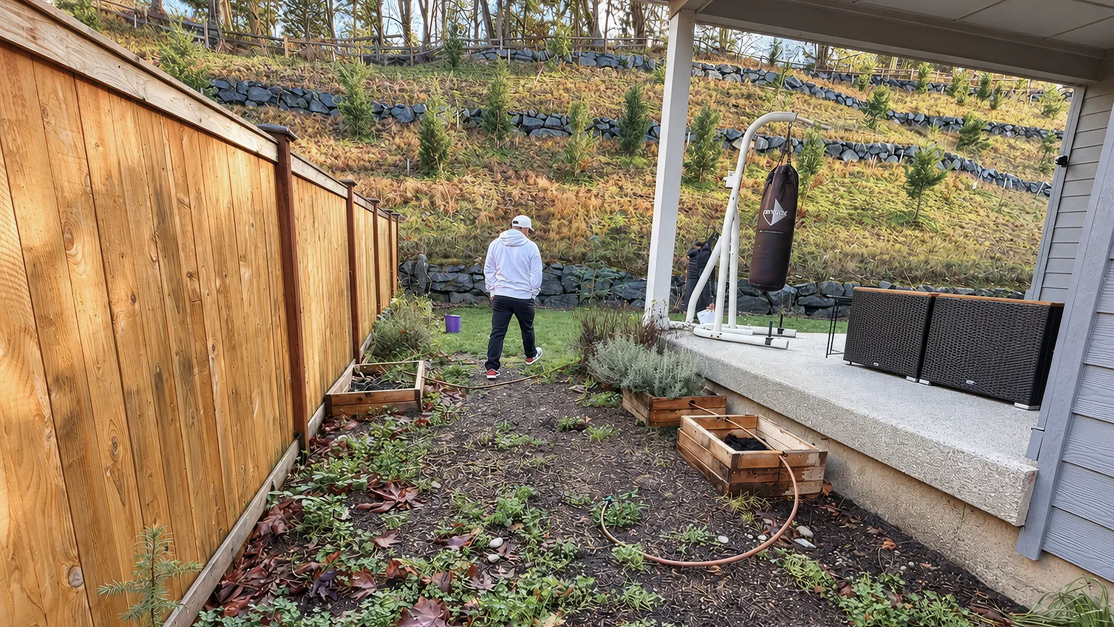 Backyard side yard and slope before retaining wall installation in Sammamish, WA