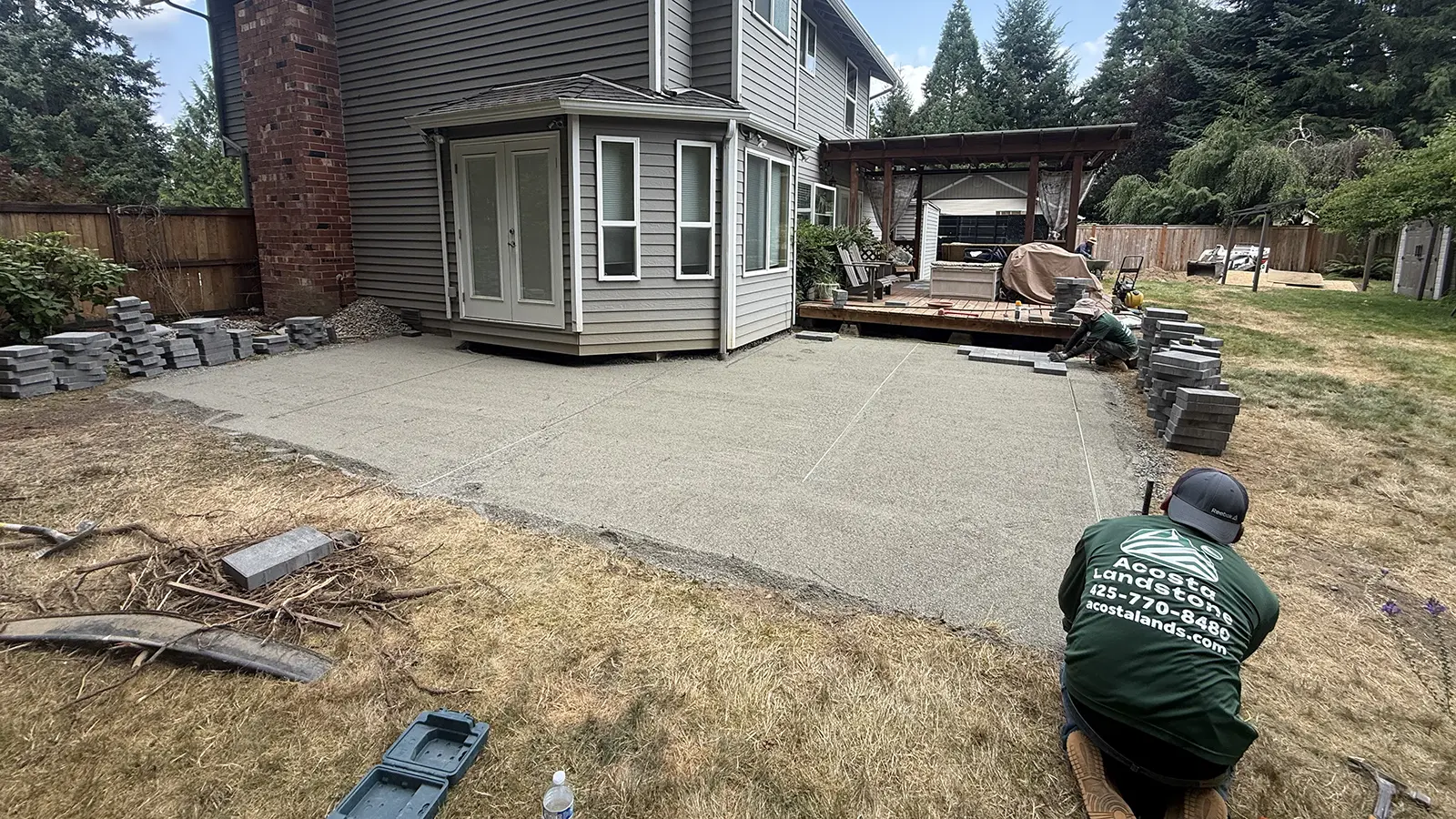 Graded and screeded paver patio base with the first pavers being laid in Duvall, WA