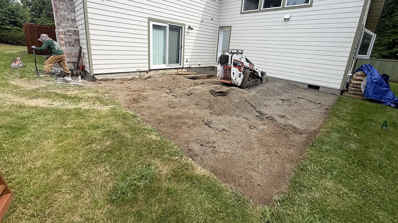 Backyard excavated for a new raised paver patio in Duvall, WA
