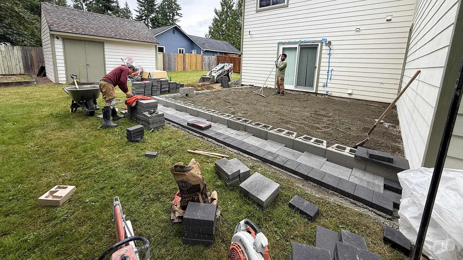 Raised patio block wall and lower paver step installation in Duvall, WA