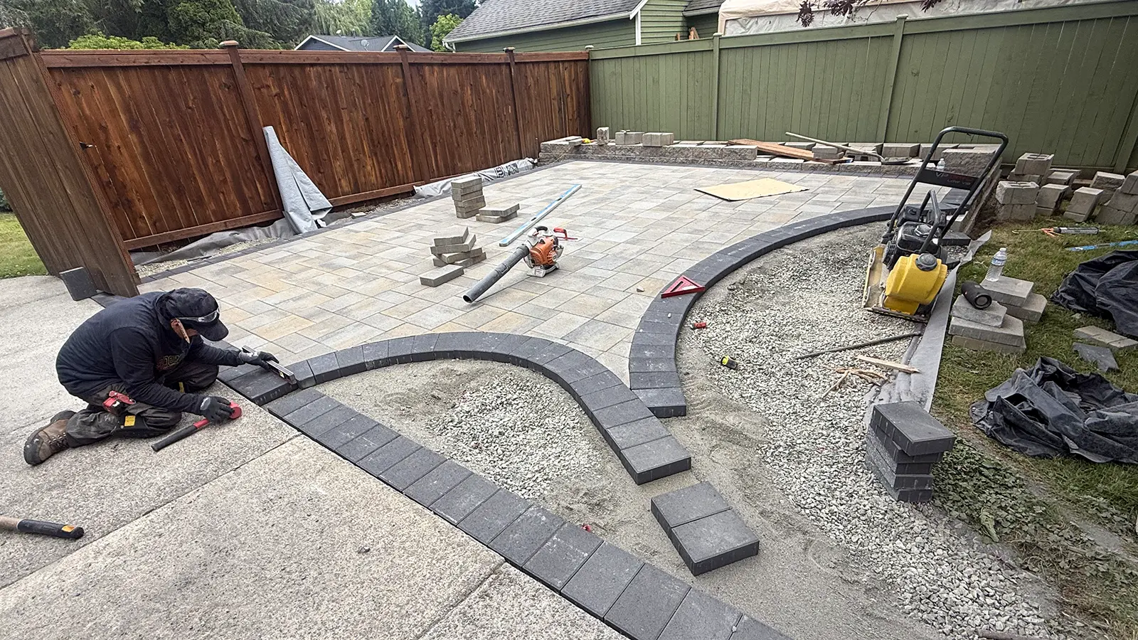 Curved charcoal paver edging installation in Duvall, WA