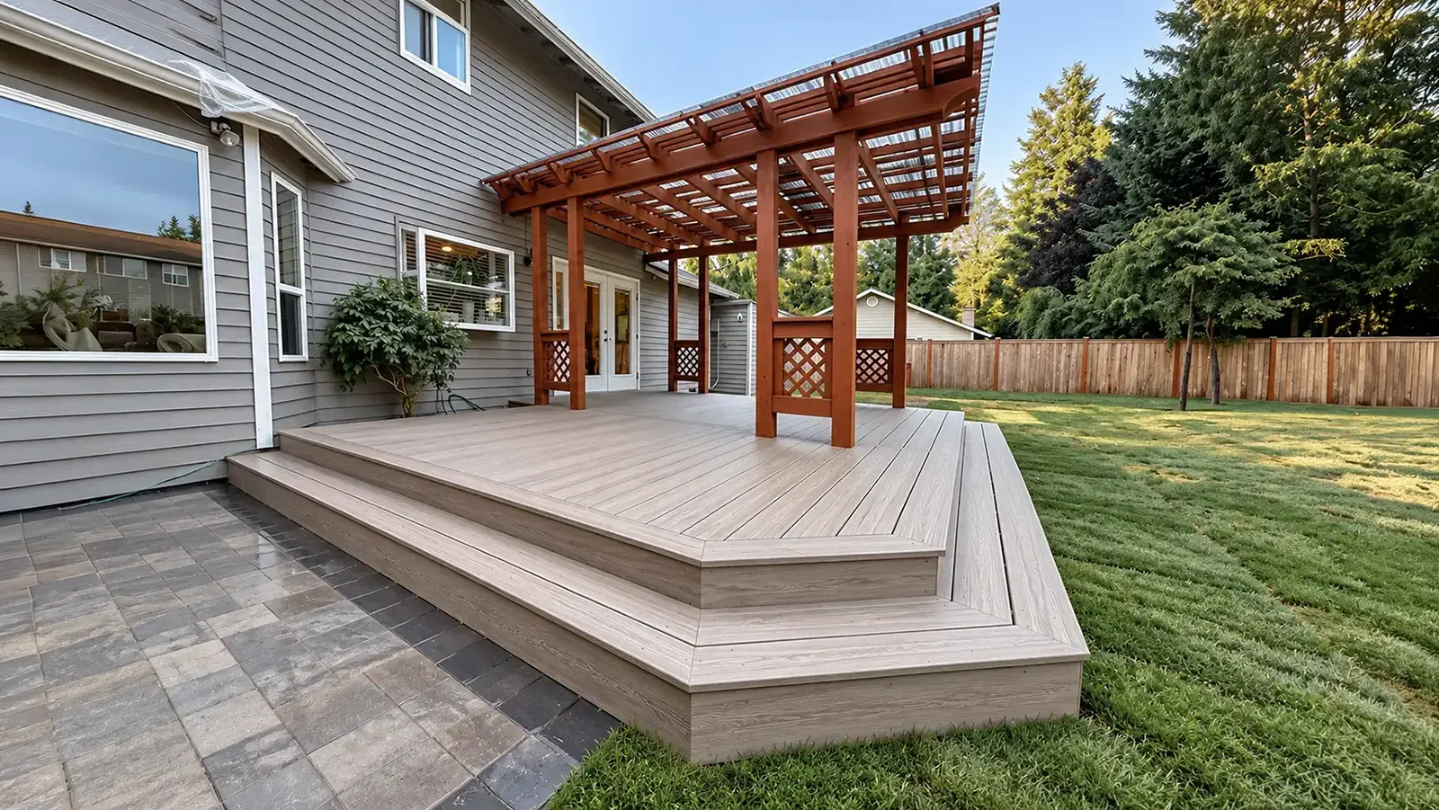 Composite deck and wood pergola in Duvall, WA by Acosta Landstone