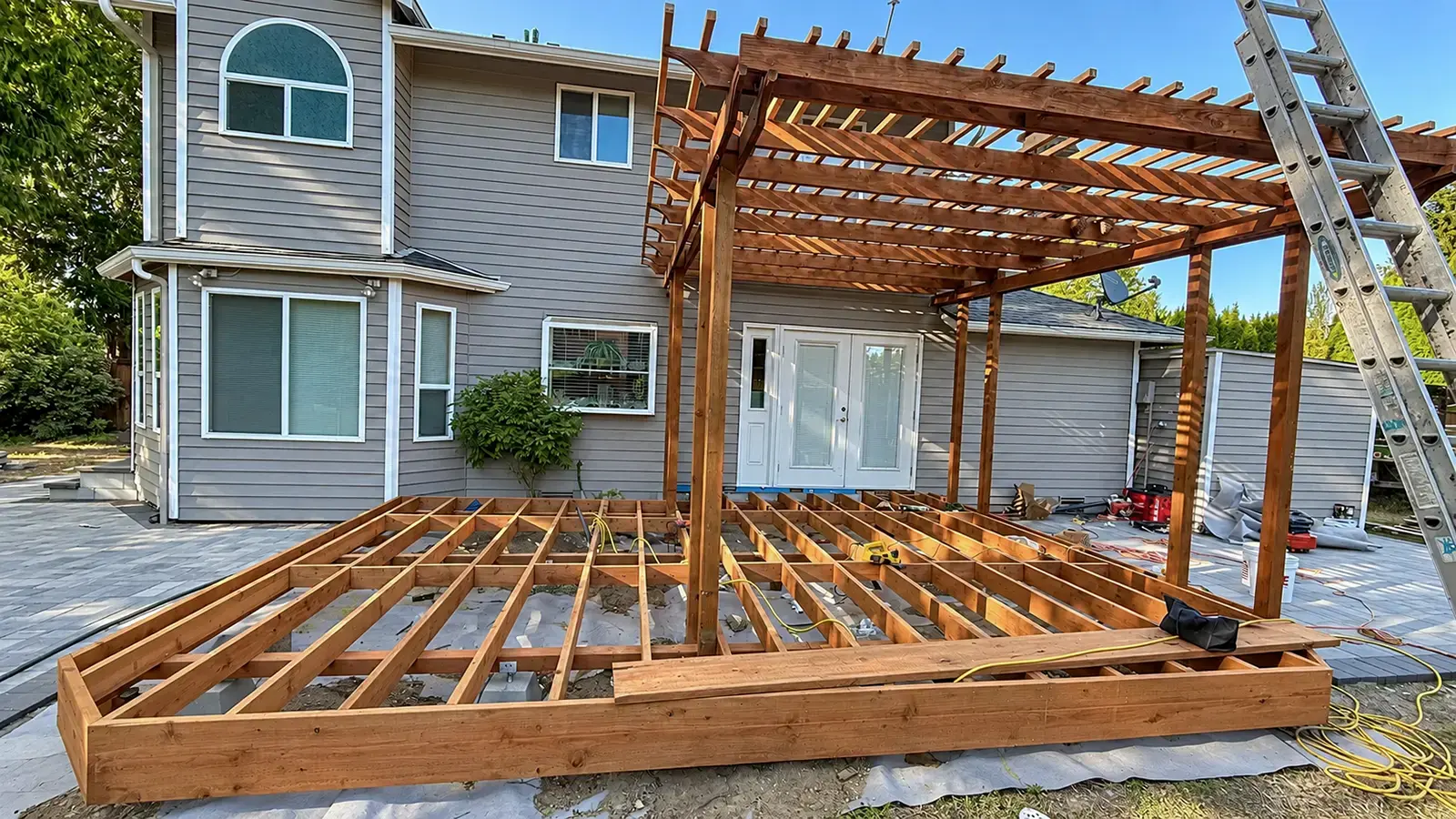 Custom deck joist frame and wood pergola under construction in Duvall, WA