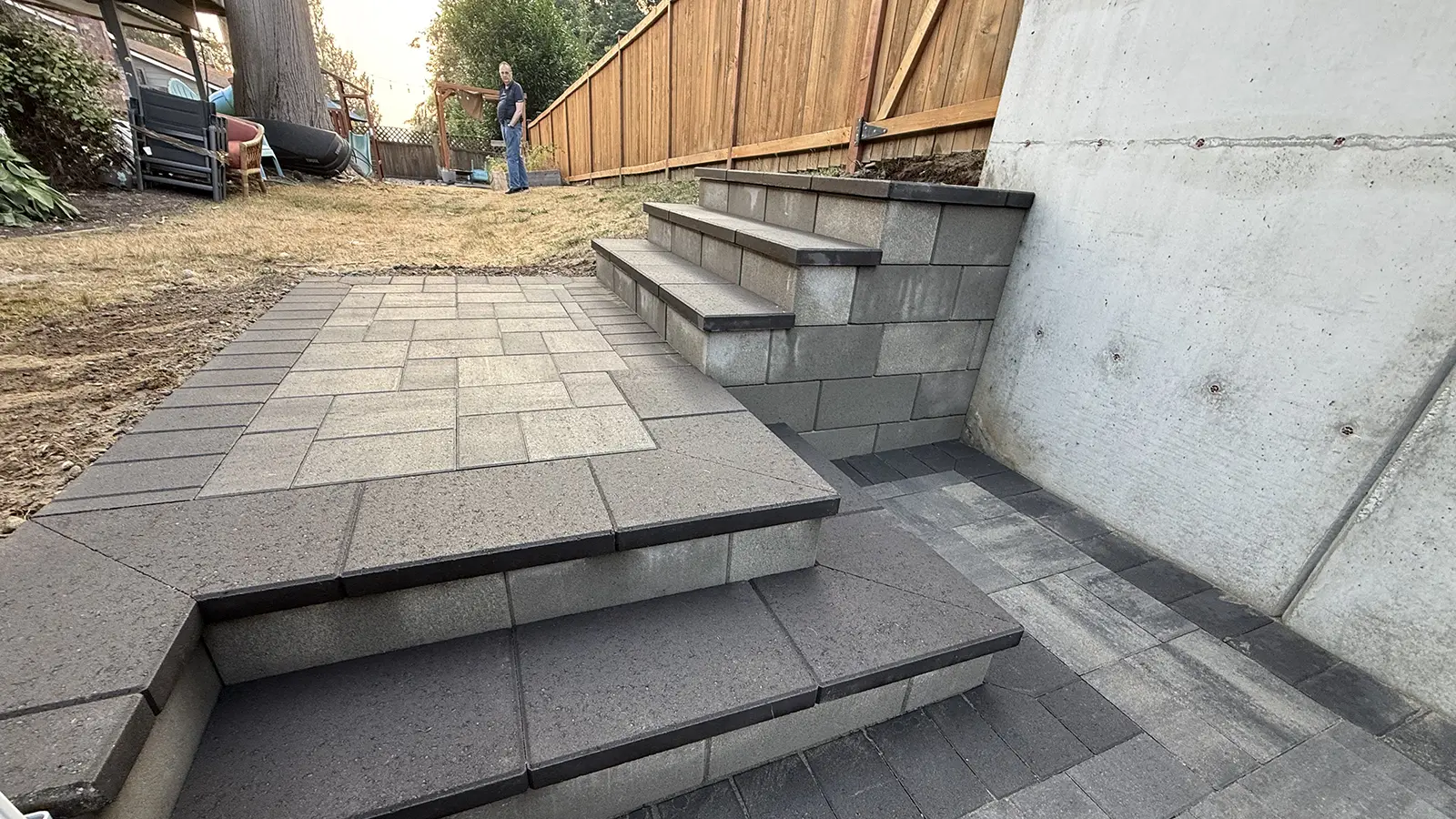 Custom paver steps and upper landing leading to the backyard in Bothell, WA