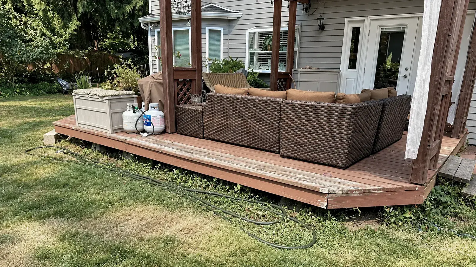 Worn deck boards and fascia on the existing backyard deck in Duvall, WA