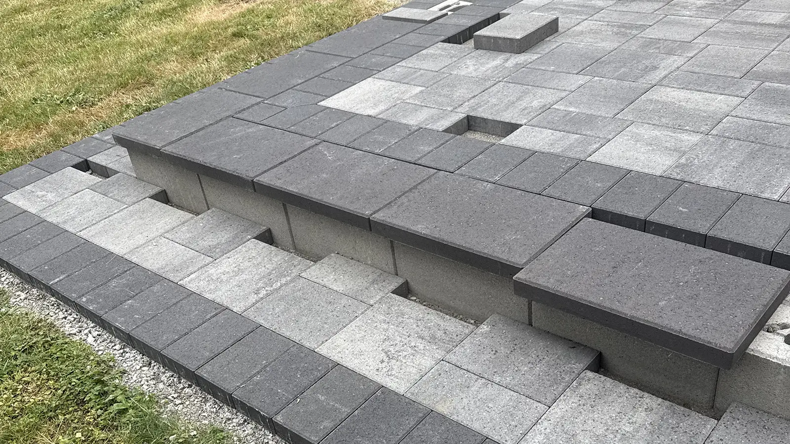Charcoal paver step caps and gray paver steps detail in Duvall, WA