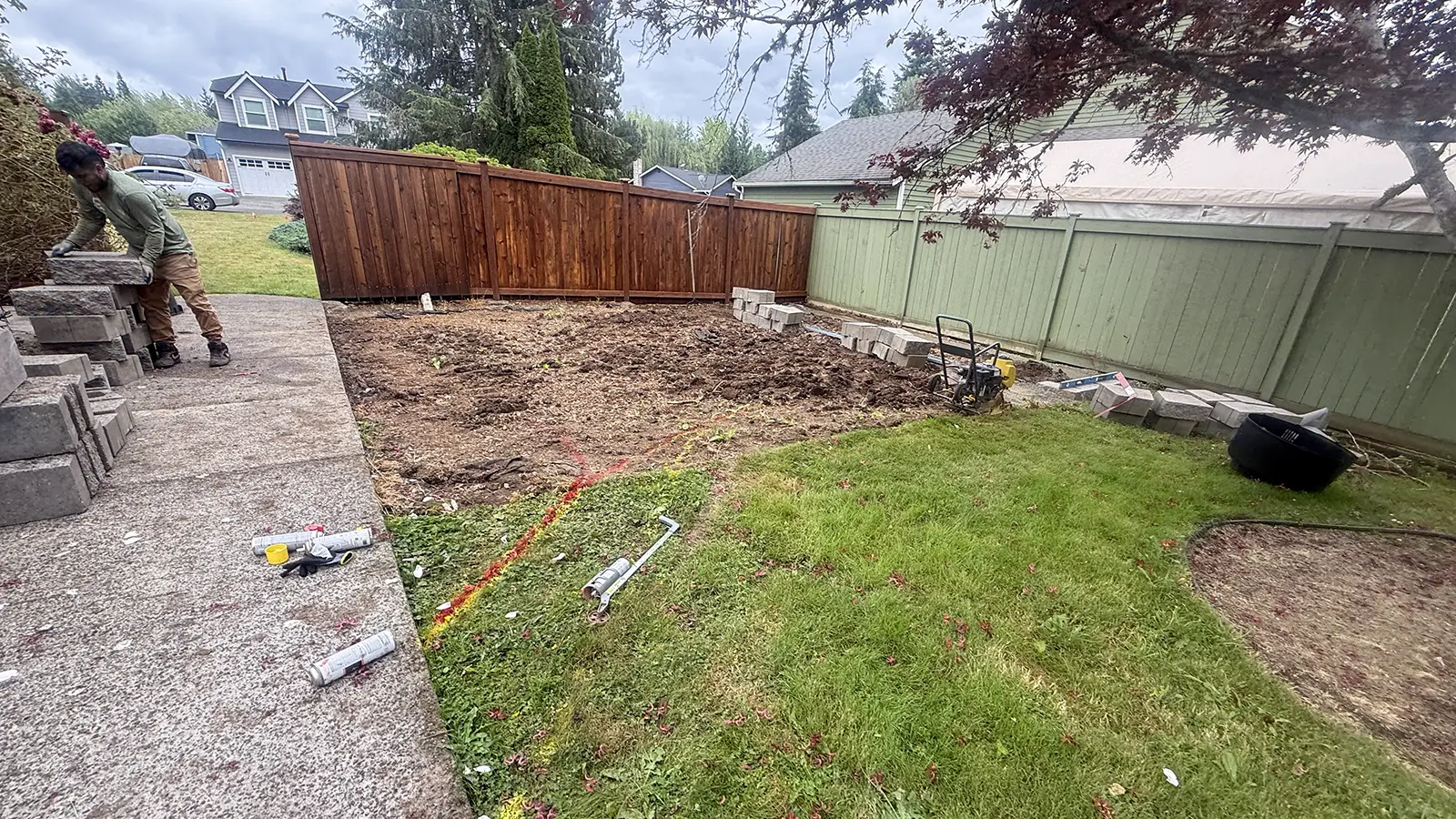 Backyard cleared and marked for a new paver patio in Duvall, WA
