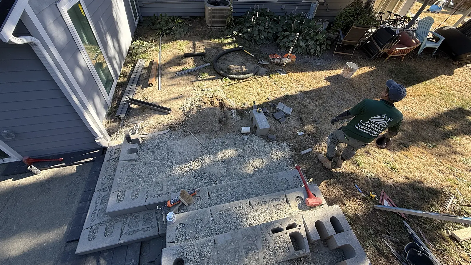 Block steps filled with gravel during paver walkway installation in Bothell, WA
