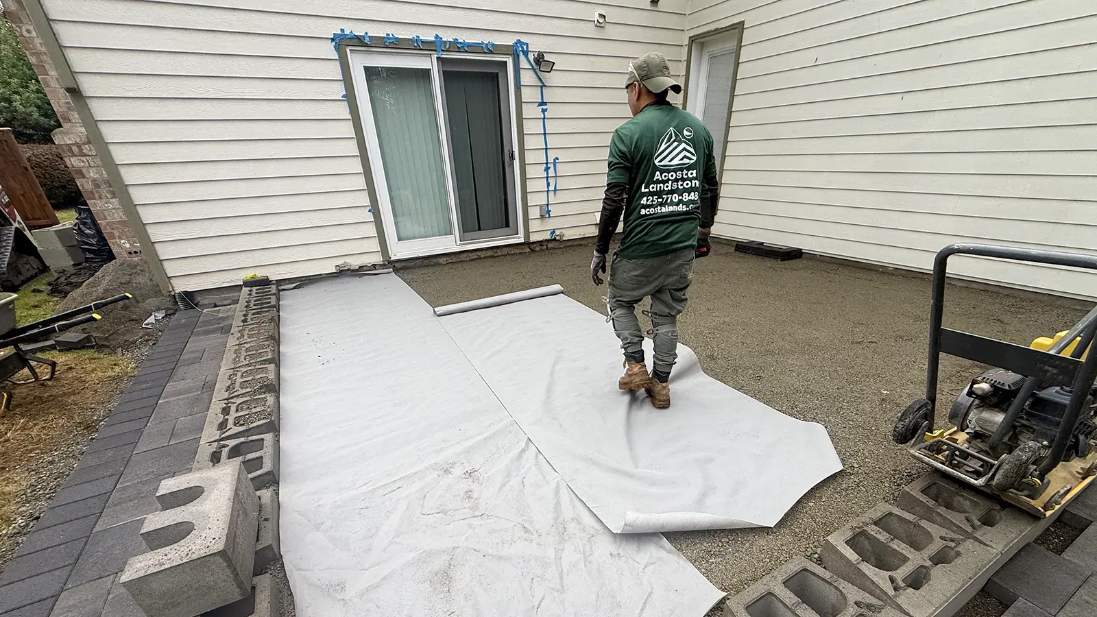 Geotextile fabric over the leveled base of a raised paver patio in Duvall, WA