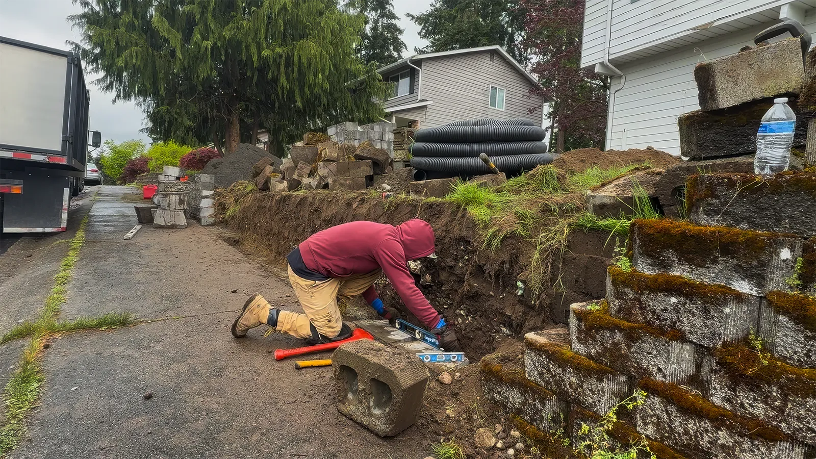 New retaining wall blocks delivered and old wall material removed in Federal Way, WA