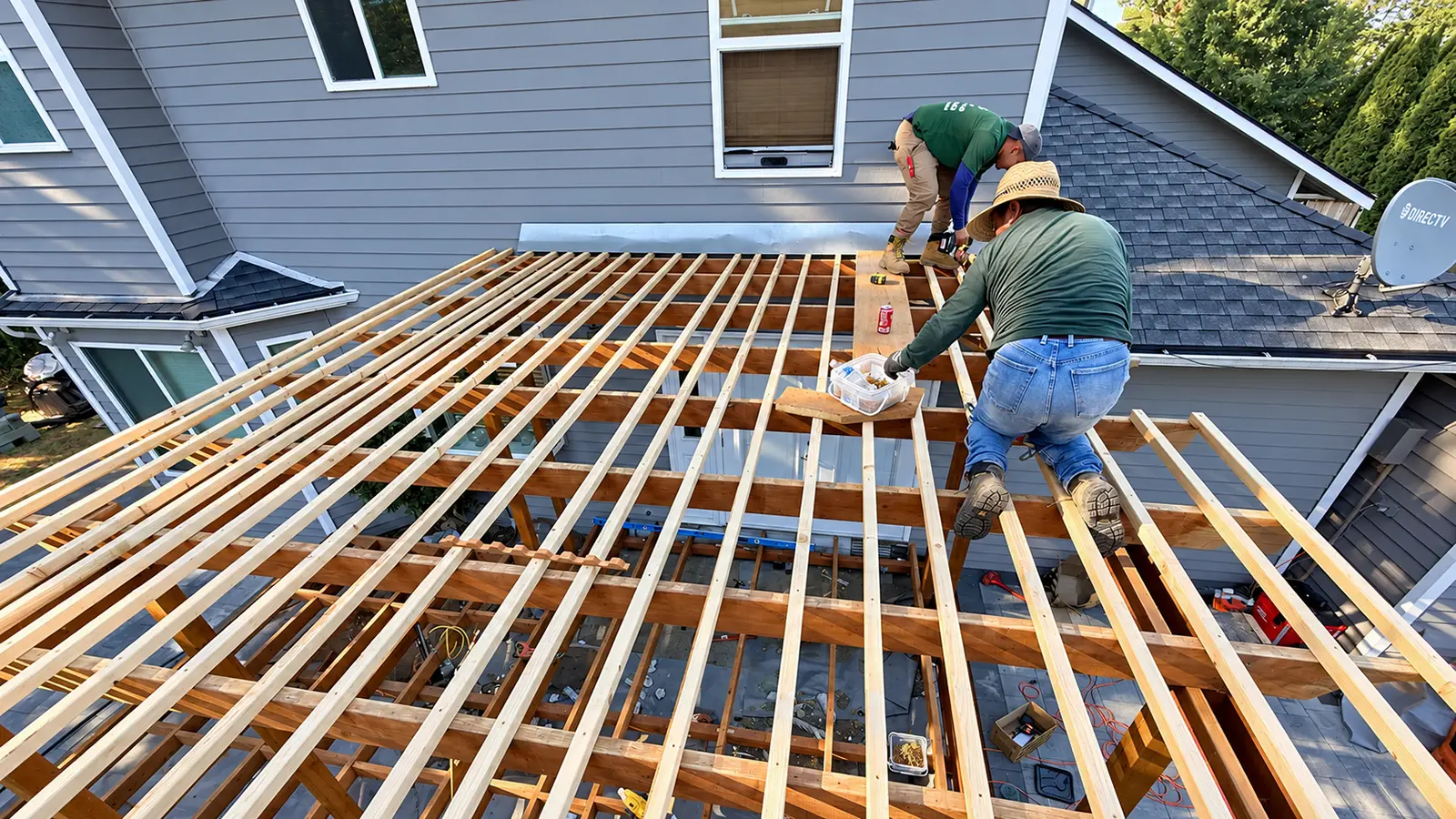 Crew installing the pergola roof slats above the deck in Duvall, WA